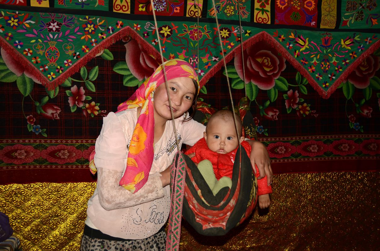 08 Yilik Headman Daughter And Her Child In A Swing In Their Sleeping Area On The Way To K2 China Trek